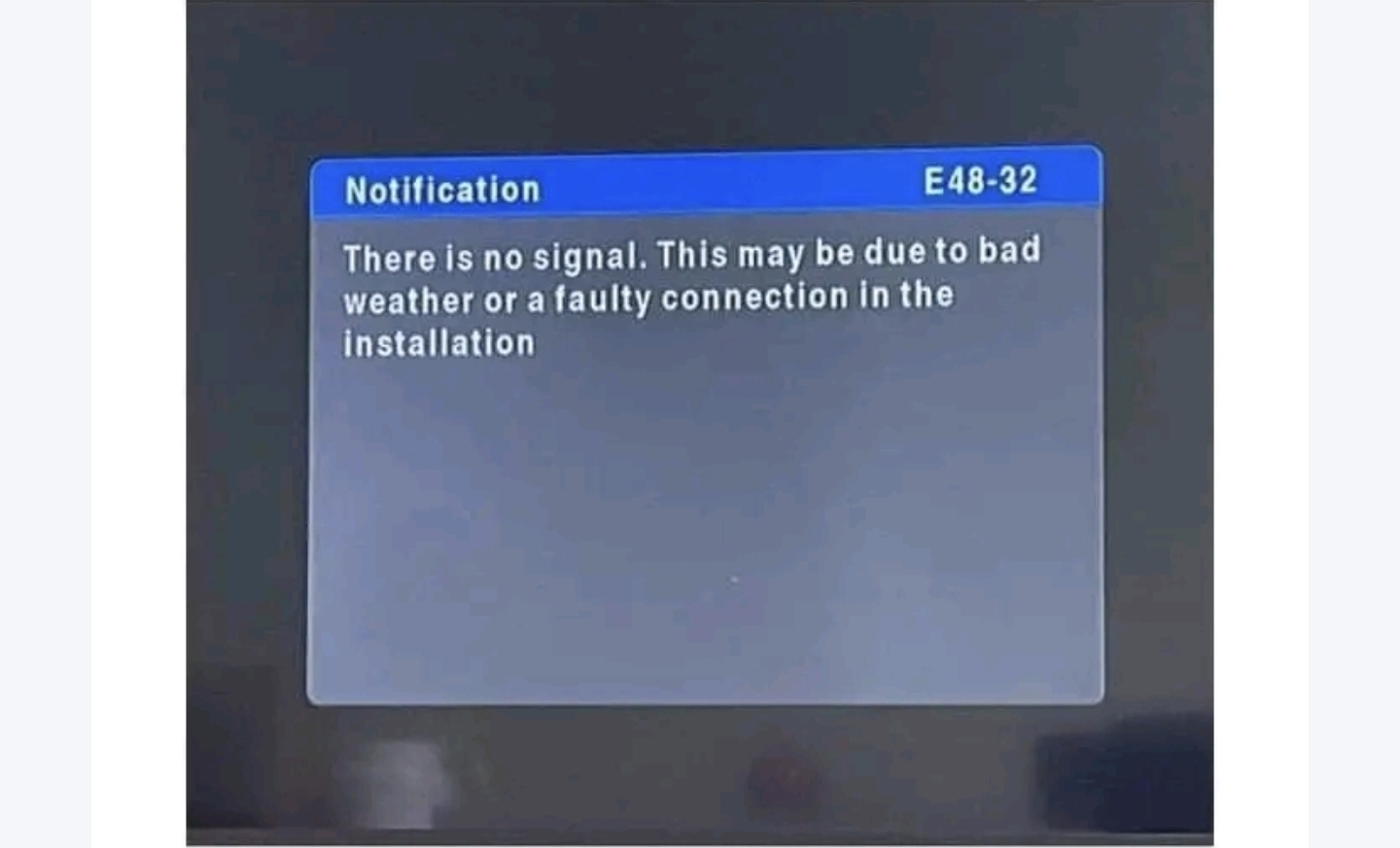 DStv E48-32 error message on a TV screen showing no signal due to bad weather or a faulty connection